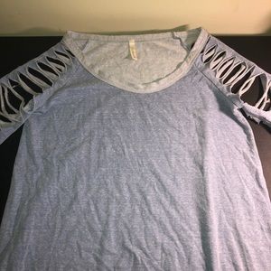 Ladies shirt with torn sleeves
